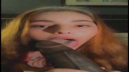 Red-haired snow White loves sucking his big black cock and gets rewarded with a warm cum on her face