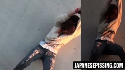 Restrained Asian babes peeing down pant legs