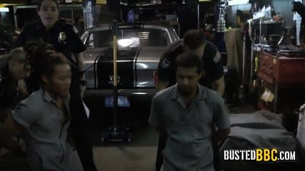 BBC enjoys fucking with two busty and horny female cops at his garage.