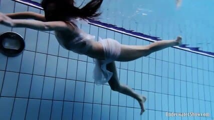 Sexy babe Aneta swims and strips naked